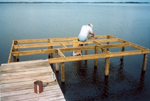 dad builds his dock again after the hurricane